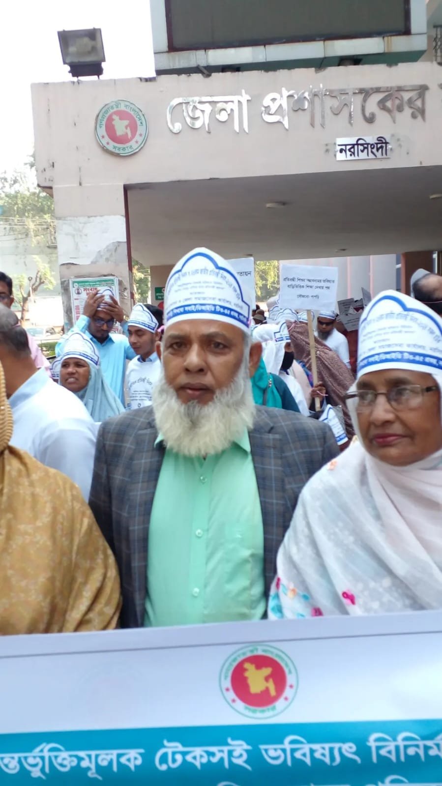 Group photo of men in caps.